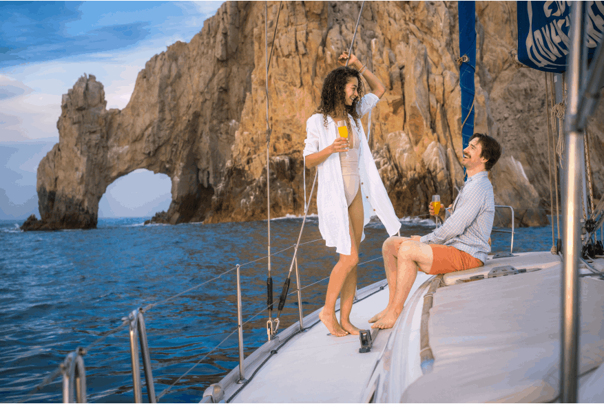 couple on boat at the los cabos arch